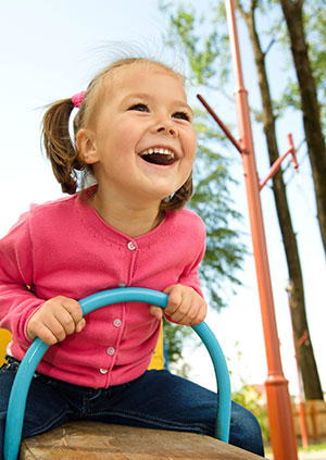 Kid in the grass - Pediatric Dentistry and Orthodontics in Burbank, CA