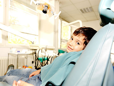 Kid in the grass - Pediatric Dentistry and Orthodontics in Burbank, CA
