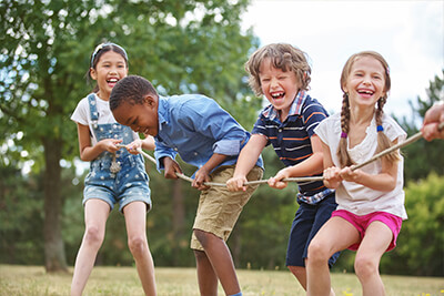 Kid in the grass - Pediatric Dentistry and Orthodontics in Burbank, CA